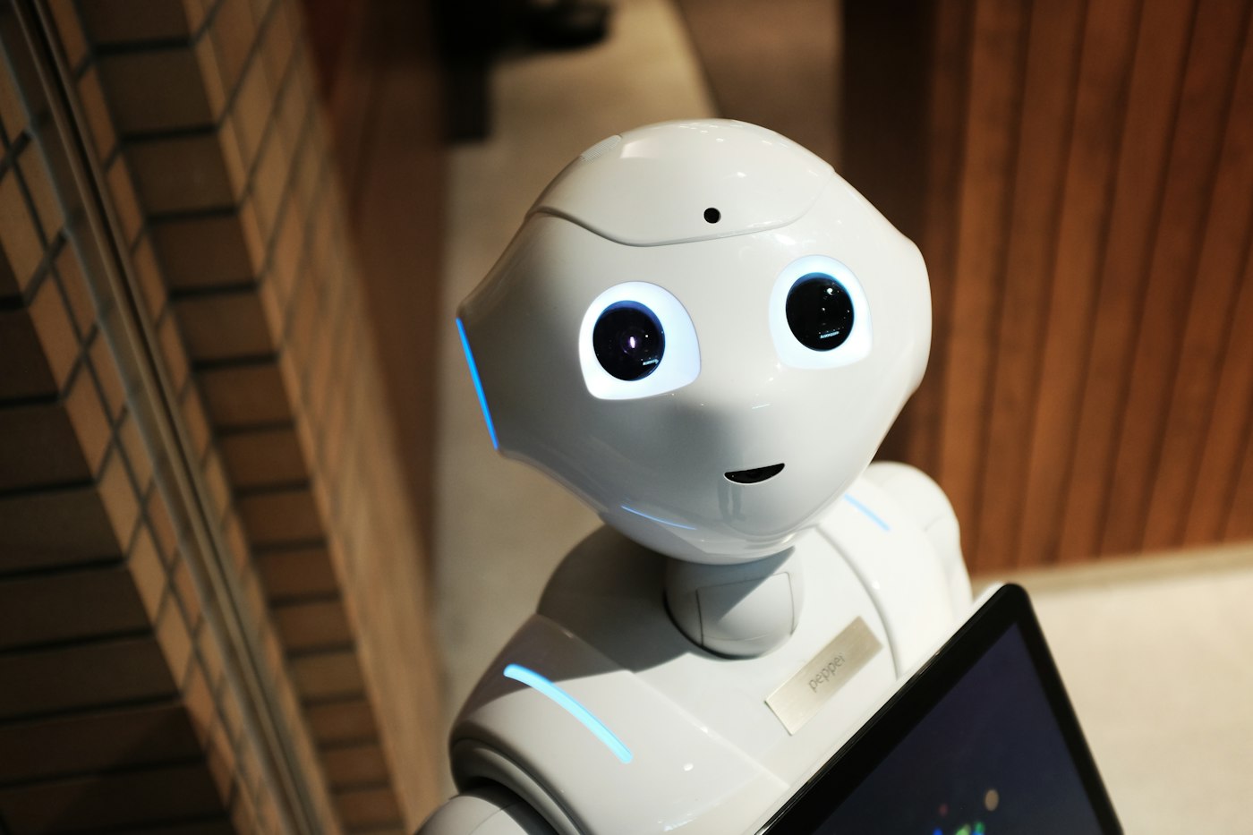A robot in a dark space, symbolizing technology capability evolving toward product delivery (illustration)